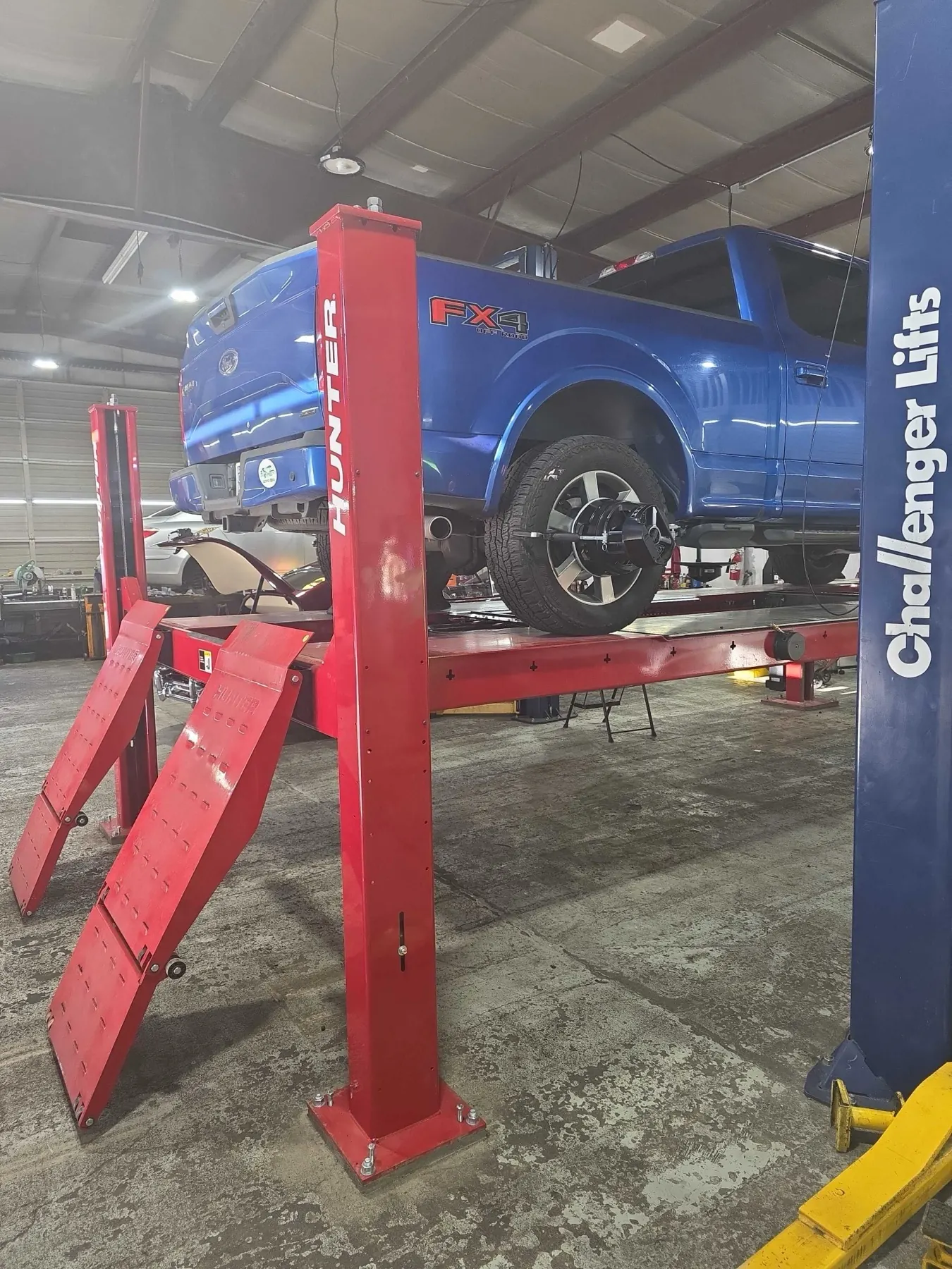 Ford F-150 FX4 on the Hunter alignment lift at Rob's Automotive Repair Center in Clackamas, Oregon