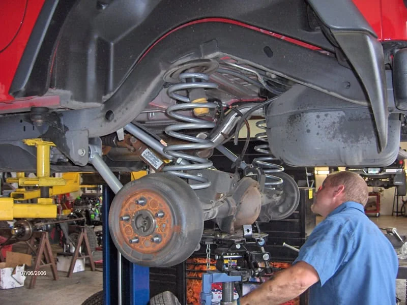ASE-Certified technician servicing a customer's vehicle at Rob's Automotive Repair Center, Clackamas, Oregon